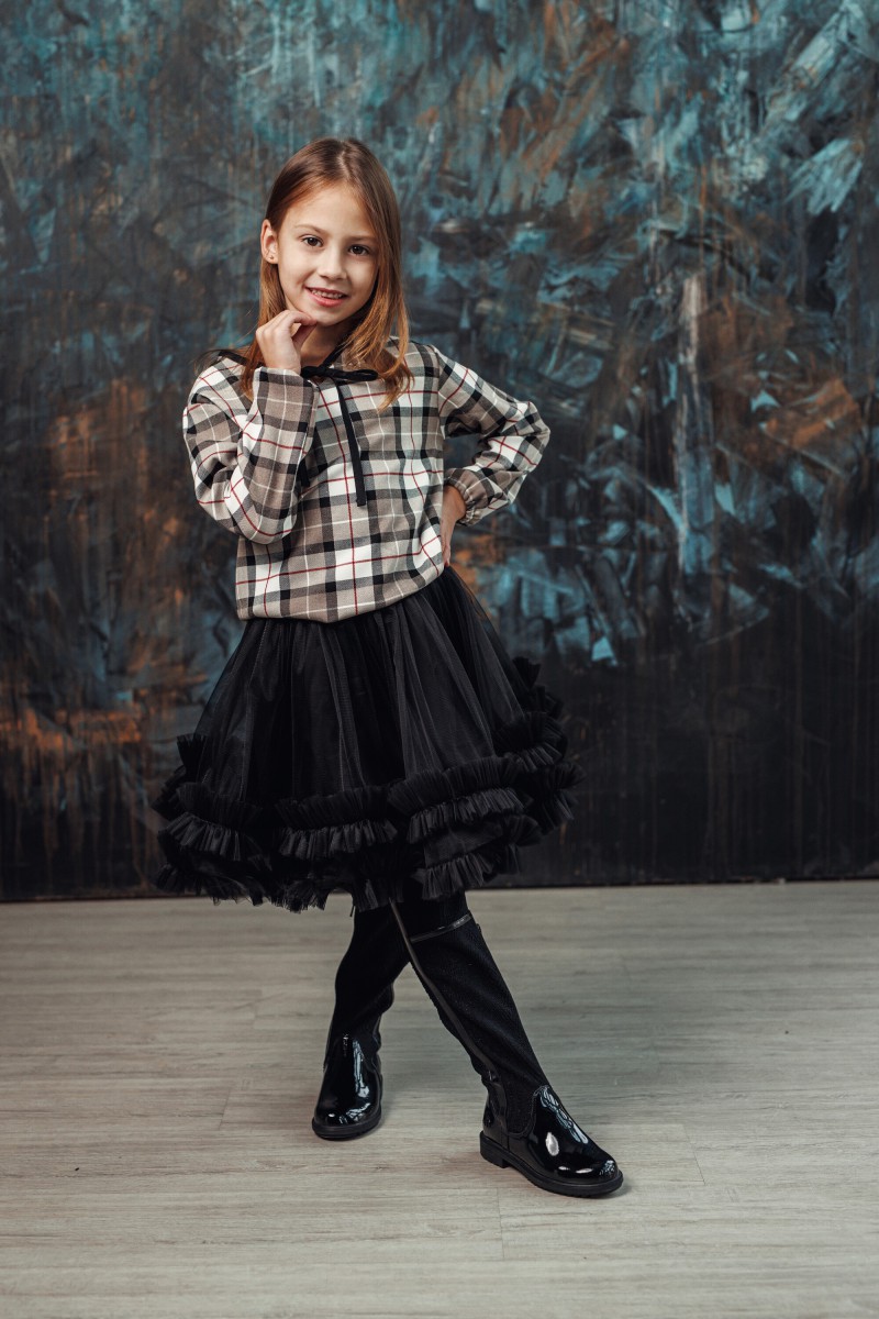 Checked blouse with a black tie bow