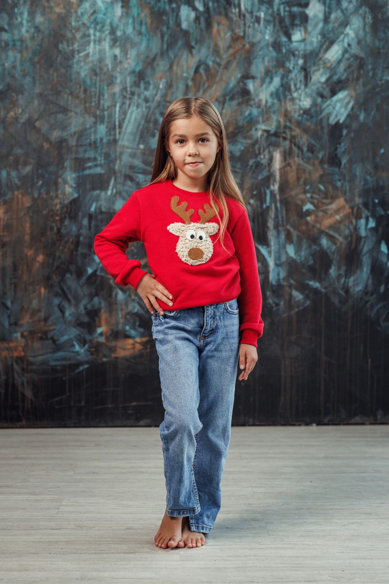 Girl's red Christmas jumper with a "Teddy" reindeer