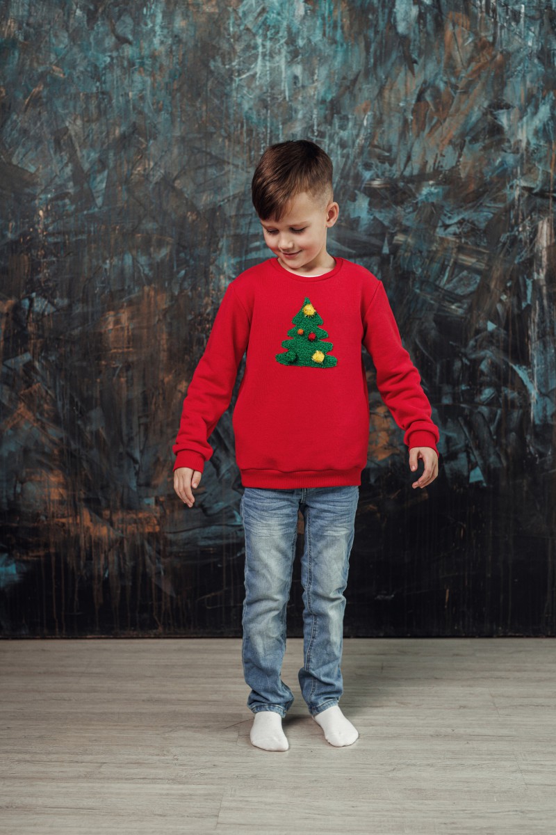Boy's red Christmas jumper with a decorated Christmas tree