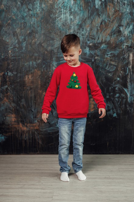 Boy's red Christmas jumper with a decorated Christmas tree