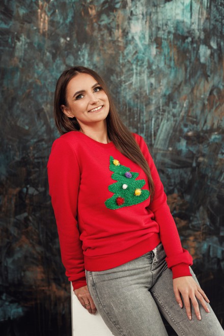 Women's red jumper with a decorated Christmas tree