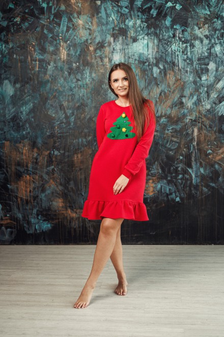 Red Christmas dress with a ruffle and a decorated Christmas tree