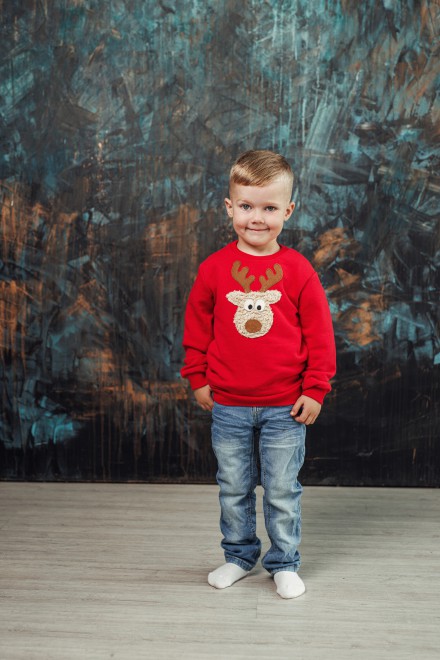 Boy's red Christmas jumper with a "Teddy" reindeer