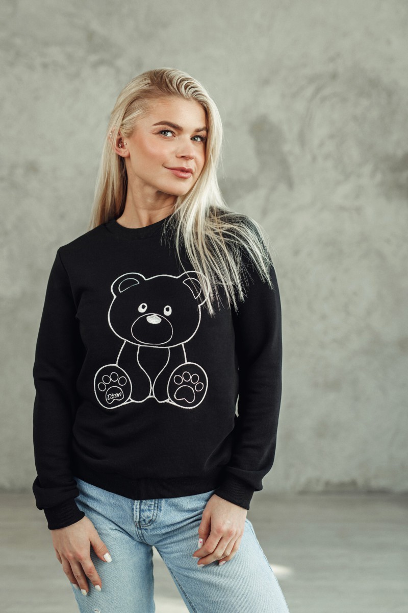 Black DZAN jumper with a teddy bear