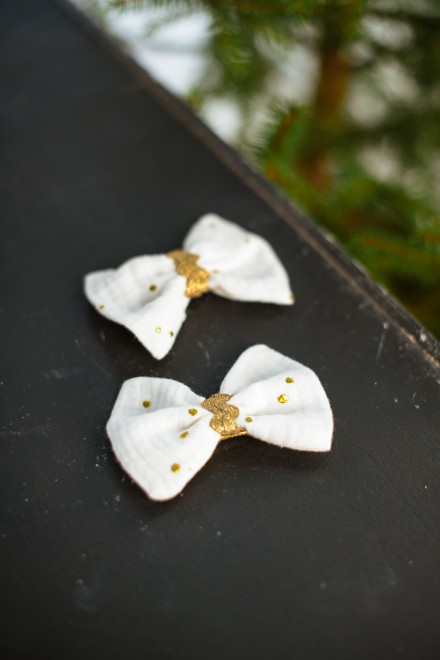 White hair clips with gold dots