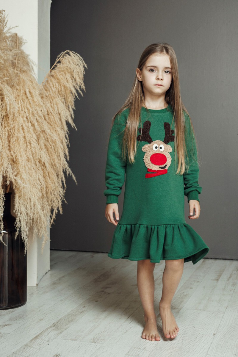 Girl's green dress with a ruffle and Rudolf