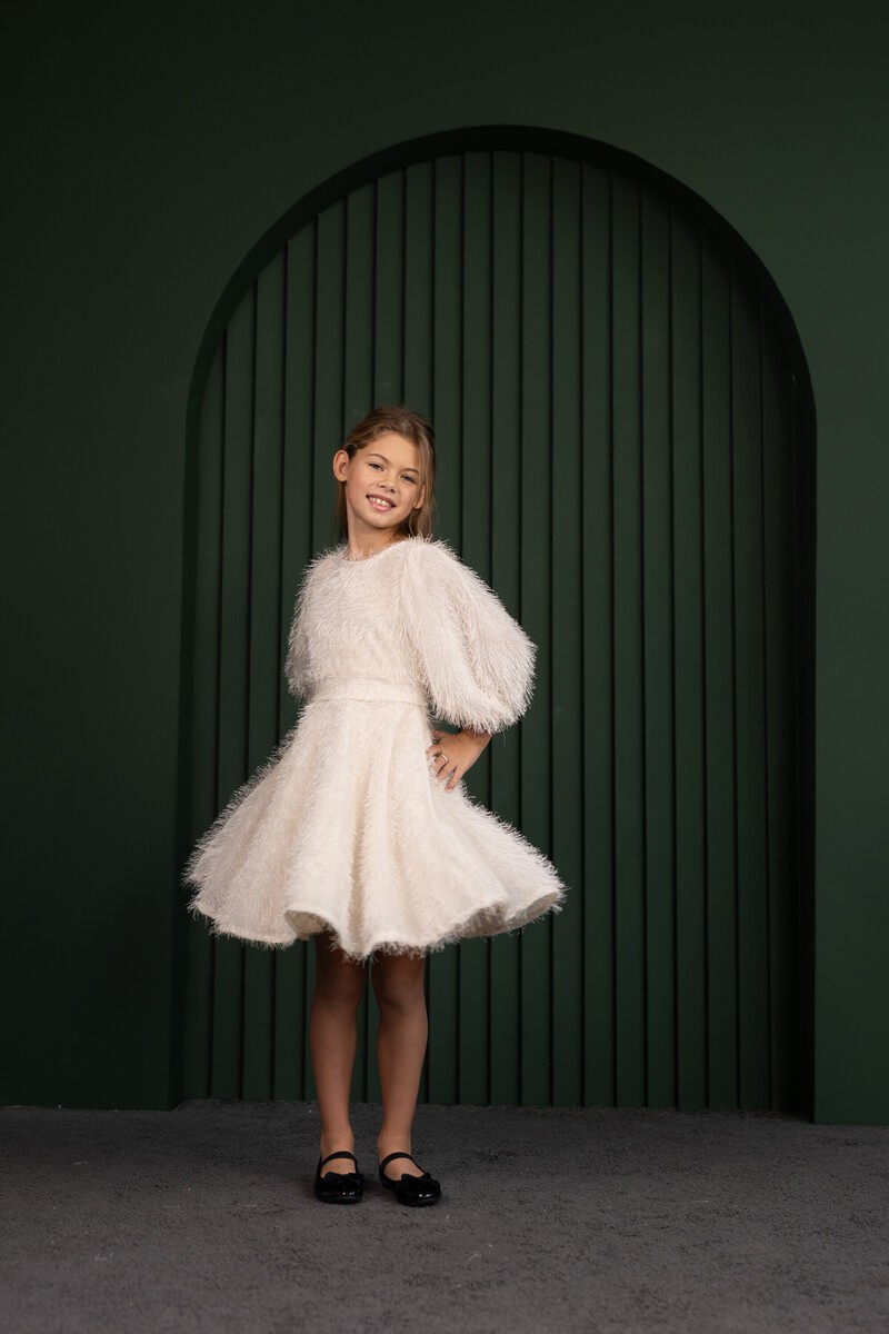Fluffy light girl's dress with puff sleeves