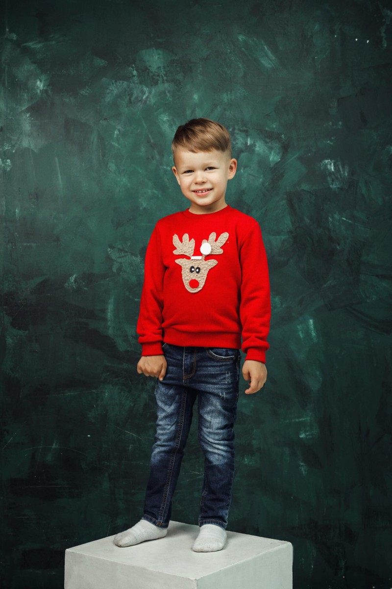 Children's red Christmas jumper with a soft reindeer