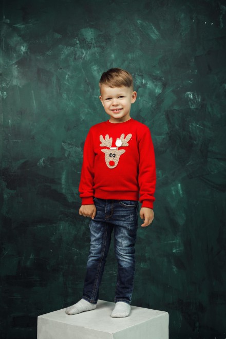 Children's red Christmas jumper with a soft reindeer