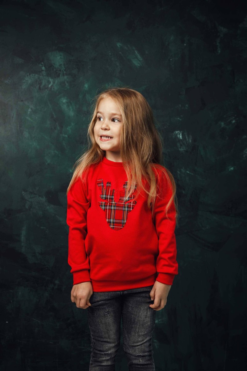 Girl's Christmas jumper with a checked reindeer