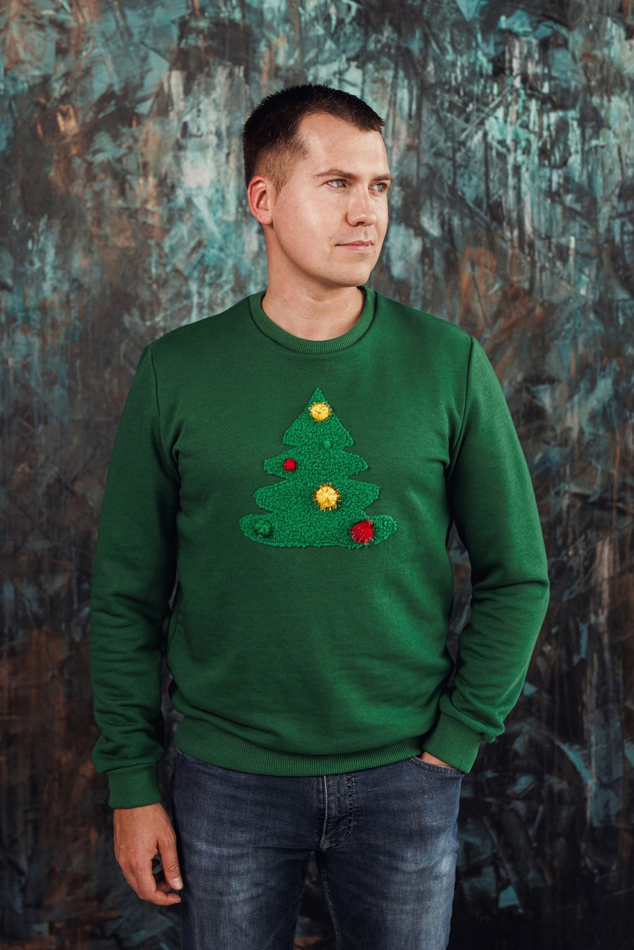 Green men's Christmas jumper with a decorated tree